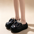 Platform bow-detail closed-toe slides